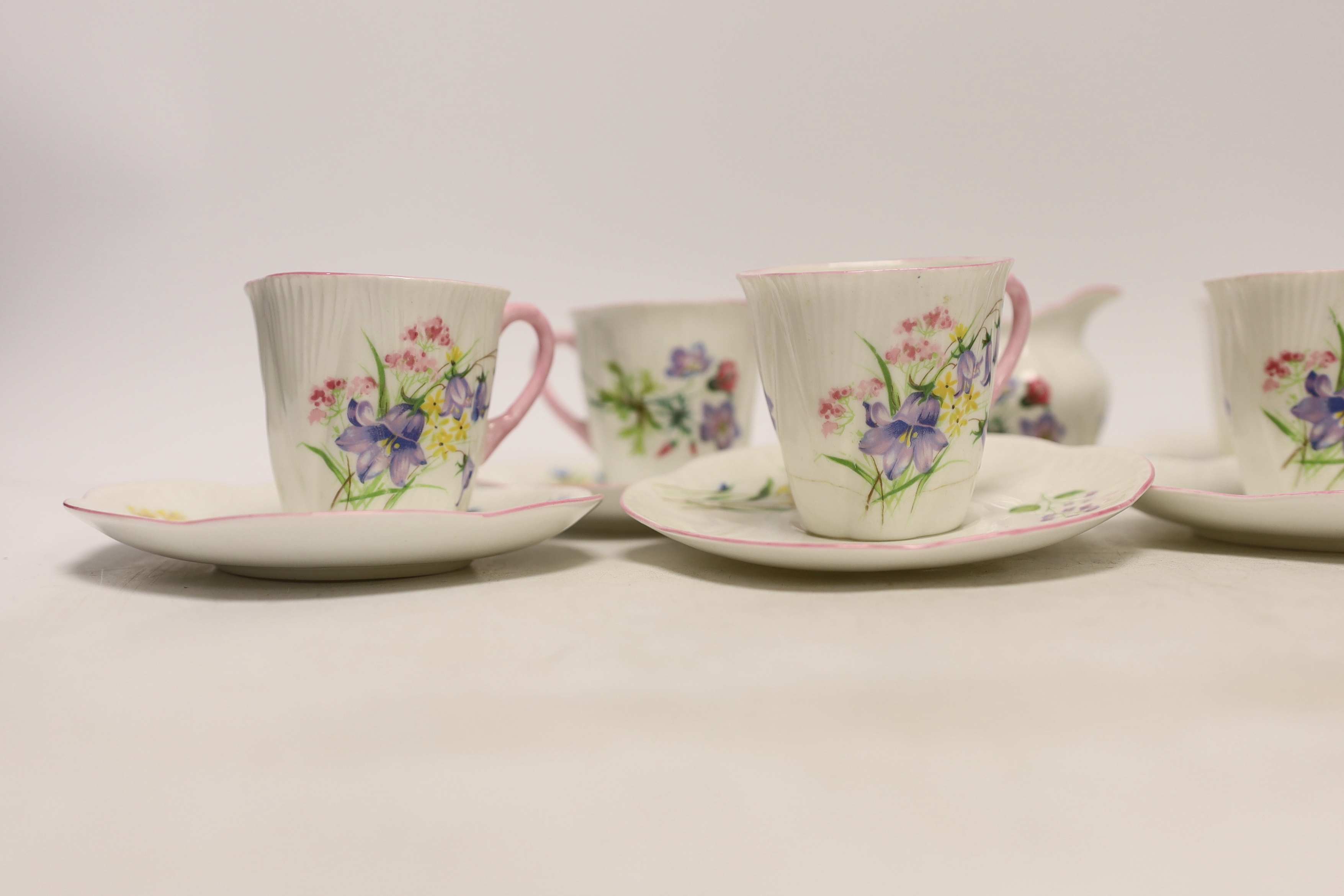 A Shelley 'wild flowers' bone china part tea set comprising milk jug and six cups and saucers